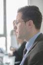 Happy young business man work in modern office.Handsome businessman in office.Real economist bussinesmen, not a model Royalty Free Stock Photo