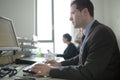 Happy young business man work in modern office.Handsome businessman in office.Real economist bussinesmen, not a model Royalty Free Stock Photo