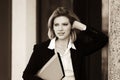 Happy young business woman with a folder standing at office building Royalty Free Stock Photo