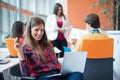 Happy young business woman with her staff, people group in background at modern bright office indoors Royalty Free Stock Photo