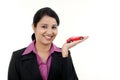 Happy young business woman holding toy car Royalty Free Stock Photo