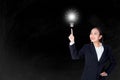 Happy young business woman pointing light bulb with inspiration and idea concept. Royalty Free Stock Photo