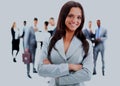 Happy young business woman standing in front of her team. Royalty Free Stock Photo
