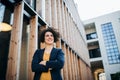 A happy young business woman standing outdoors, resting. Royalty Free Stock Photo