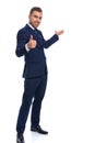 Happy young businessman making thumbs up gesture and smiling Royalty Free Stock Photo