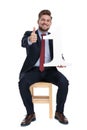 Happy young businessman making thumbs up sign Royalty Free Stock Photo