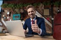 Happy young businessman making thumbs up sign Royalty Free Stock Photo
