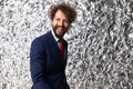 Happy young businessman in navy blue suit looking up and smiling Royalty Free Stock Photo