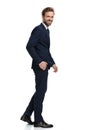 Happy young businessman in navy blue suit smiling Royalty Free Stock Photo