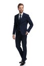 Happy young businessman in navy blue suit smiling Royalty Free Stock Photo