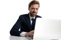 Happy young businessman in navy blue suit smiling Royalty Free Stock Photo