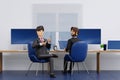 Happy young businessman relaxing meeting talking working in office, 3D rendering Royalty Free Stock Photo