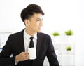 Happy young businessman relaxing in office Royalty Free Stock Photo