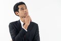 happy young businessman smiling and thinking in formal suit isolated on white background Royalty Free Stock Photo