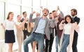 happy young businessman standing in front of his business team. Royalty Free Stock Photo