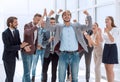 happy young businessman standing in front of his business team. Royalty Free Stock Photo