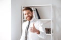 Happy young businessman with thumbs up gesture Royalty Free Stock Photo