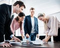 Young business team enjoying success at conference table Royalty Free Stock Photo