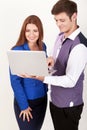 Happy young businesspeople holding laptop Royalty Free Stock Photo