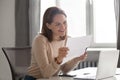 Happy young businesswoman reading great news in paper mail letter Royalty Free Stock Photo