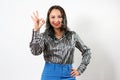 Happy young businesswoman showing ok sign on a white background Royalty Free Stock Photo