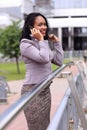 Happy young businesswoman talking on cell phone Royalty Free Stock Photo