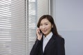 Happy young businesswoman talking with a mobile phone Royalty Free Stock Photo