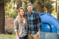 Happy young camper couple looking at the camera Royalty Free Stock Photo