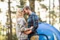 Happy young camper couple touching foreheads Royalty Free Stock Photo