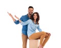 Happy young casual couple welcoming you Royalty Free Stock Photo