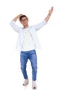 Happy young casual man holds hat and celebrates Royalty Free Stock Photo