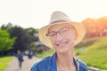 Happy young caucasian bald woman in hat and casual clothes enjoying life after surviving breast cancer. Portrait of beautiful Royalty Free Stock Photo