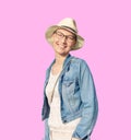 Happy young caucasian bald woman in hat and casual clothes enjoying life after surviving breast cancer. Portrait of beautiful Royalty Free Stock Photo