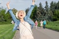 Happy young caucasian bald woman in hat and casual clothes enjoying life after surviving breast cancer. Portrait of beautiful