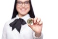 Happy young caucasian businesswoman showing bitcoin Royalty Free Stock Photo