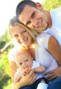 Happy Young Caucasian Family Enjoying Outdoor