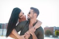 Happy young caucasian urban couple embracing at outdoors Royalty Free Stock Photo