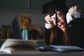 Happy young caucasian woman celebrating college graduation, sitting at front laptop at home during online conference Royalty Free Stock Photo