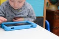 Child using a tablet touch screen device Royalty Free Stock Photo