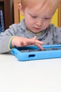 Child using a tablet touch screen device Royalty Free Stock Photo