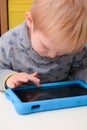 Child using a tablet touch screen device Royalty Free Stock Photo