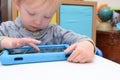 Child using a tablet touch screen device Royalty Free Stock Photo