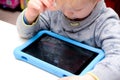Child using a tablet touch screen device Royalty Free Stock Photo