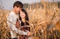 Happy young couple in autumn corn field Royalty Free Stock Photo