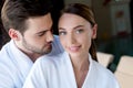 happy young couple in bathrobes resting together Royalty Free Stock Photo