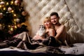 happy young couple in bed at home with their cat Royalty Free Stock Photo