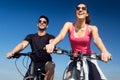 Happy young couple on a bike ride in the countryside Royalty Free Stock Photo