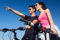 Happy young couple on a bike ride in the countryside Royalty Free Stock Photo