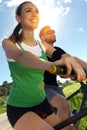 Happy young couple on a bike ride in the countryside Royalty Free Stock Photo