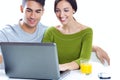 Happy young couple browsing internet at home Royalty Free Stock Photo